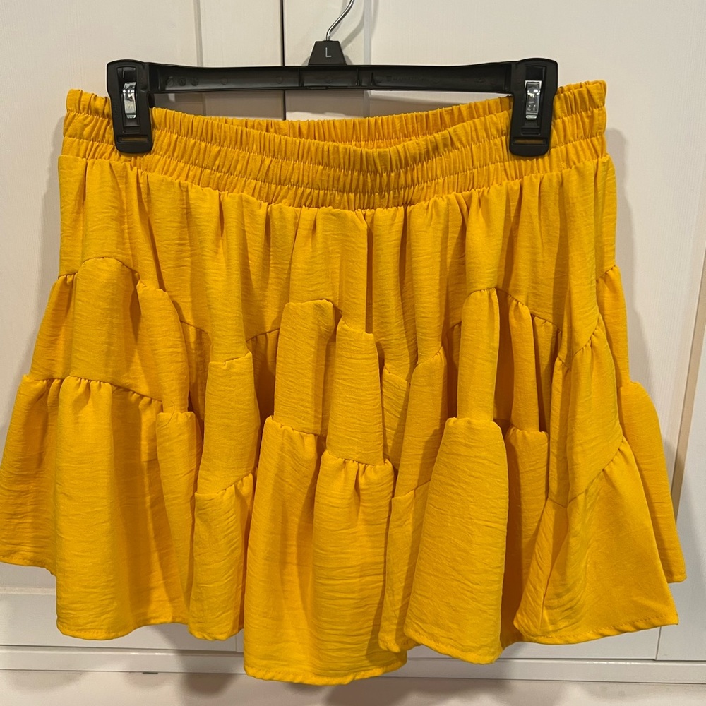 Adorable mini skirt with shorts under.